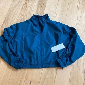 Layer 8 trailblazer packable wind jacket.  NWT S